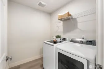 Laundry room, complete with full-size washer/dryer set.