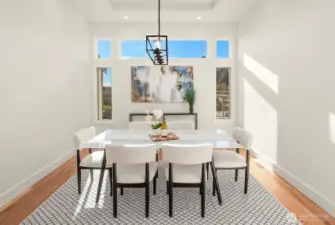 Formal dining — elegant table framed by soft light, perfect for intimate dinners and grand celebrations.