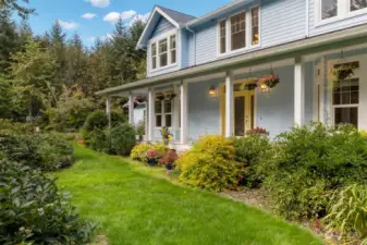 Charming covered porch provides a tranquil space perfect for enjoying the surrounding natural beauty