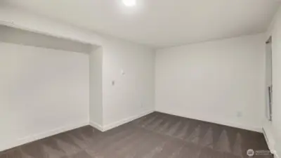 Another sizable guest bedroom with open closet.