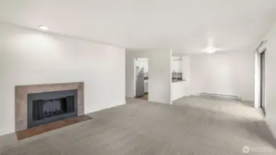 An open floorplan seamlessly flows into the dining area and kitchen.