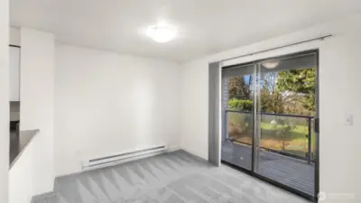 Dining space with slider that leads to your private balcony providing an abundance of light.