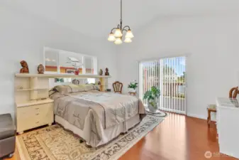 The primary suite has its own access to the deck facing Duck Lake. Genuine hardwood floors and vaulted ceiling make the space. So much room to catch a restful nights sleep.