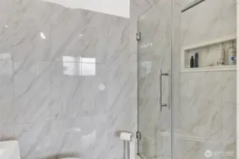 The walk-in shower has rain fall shower head and several jetted nozzles to wash away the stress.  The number of settings to chose from seem endless.
