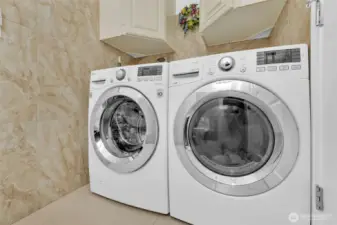 Laundry is conveniently located to the bedrooms. Cabinets can hold all your laundry supplies and extra linens.