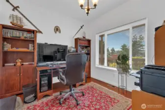 Dedicated office space with glass paneled French Doors.