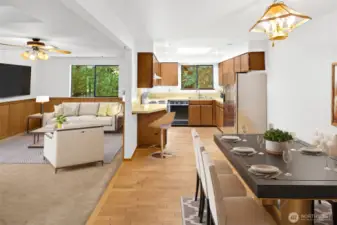 Virtually staged eat-in kitchen, dining area and family room. Kitchen refrigerator is virtual.