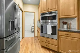 New stainless steel appliances & butler's pantry in background
