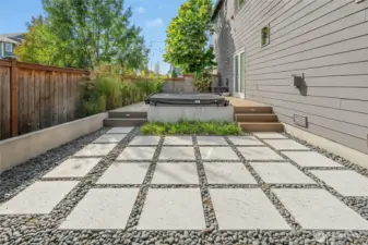 Zen hardscaping as you relax and unwind in the hot tub above