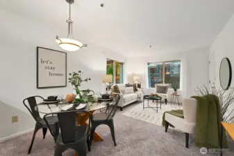 Enjoy a meal in the comfortable dining area. New carpet and paint throughout the condo.