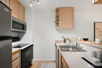 Tidy galley kitchen has everything you need.