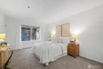 Primary bedroom is spacious and features an exterior door out to the patio.