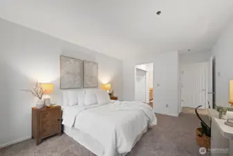 Primary bedroom with an en suite bathroom.