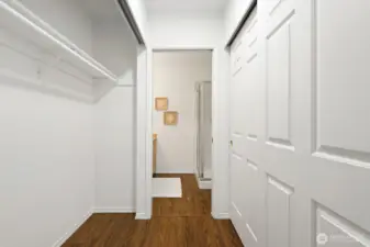 Large closet area is located on the way into the en suite bathroom.