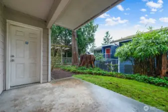 Exterior patio space with access from both the living room and the primary bedroom.