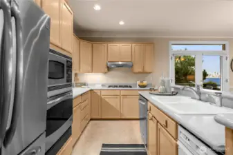 Large kitchen with deep double basin ceramic sink in this island facing all your views.