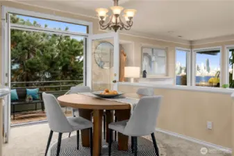 The dining room has French doors that lead out to a 2nd private deck off the North side of this corner unit.