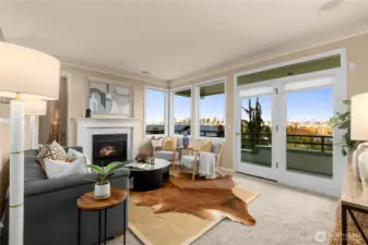The living room features a wall of windows to the incredible views and a cozy gas fireplace.