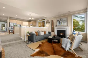 This view shows the living room looking towards the dining and kitchen.