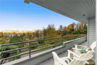 There are 2 private decks for this unit. This is the one that runs the entire front of this home with doors to access from the living room and primary suite.