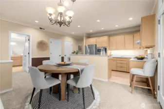 This photo shows dining to kitchen. The open door is to the primary suite and the two closed doors are the pantry closet and utility room.