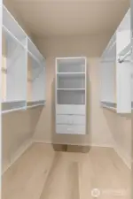 The walk-in-closet has custom shelving and drawers and the same LTV (luxury vinyl plank) flooring that is in the main bathroom.