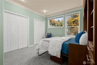 The second bedroom has two closets, lots of space, and a built-in murphy bed (included in the sale).