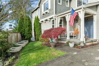 Front Porch & Garden: Thoughtful landscaping and raised garden beds add charm and a touch of Duvall’s small-town character.