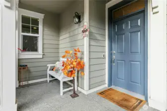 Front Entry: A cheerful first impression with a welcoming front porch—perfect for a quiet morning coffee or greeting guests. The classic blue door and thoughtful details set the tone for the warmth and character found throughout the home.
