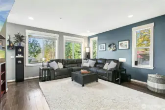 Living Room:  Bright and comfortable, this spacious living room offers the perfect place to unwind. Large windows frame the surrounding greenery, bringing the beauty of Duvall indoors. Whether enjoying a quiet evening by the fire or a movie night, this room makes every moment feel right at home.