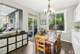 Dining Area:  A bright and inviting dining space that opens to the backyard patio, perfect for indoor-outdoor living. Natural light pours through the large windows, while the built-in buffet offers both charm and functionality—an ideal spot for gathering over good food and conversation.