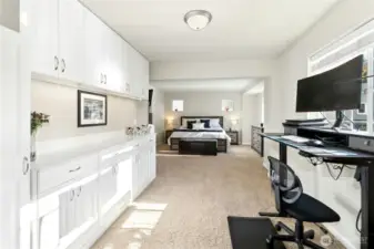 Primary Suite:  Spacious and light-filled, the primary suite offers a peaceful retreat with room to unwind and recharge. Thoughtful built-ins provide exceptional storage and organization, while the sitting area and soft natural light create a calm, inviting atmosphere that feels both open and private.