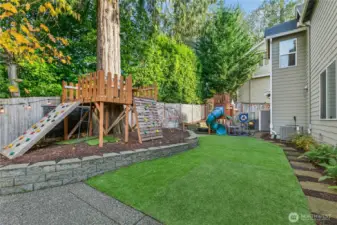 Fun and functional outdoor space with turf lawn, dual play structures, and plenty of room to relax or entertain.