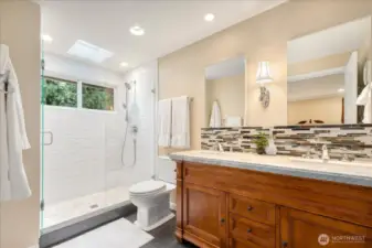 Beautiful primary bath w/heated floors + outlet in the vanity for your toothbrush!