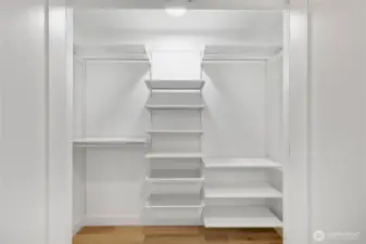 One of two spacious closets on the lower level - this one featuring custom built-in shelving.