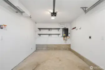 Attached full-size garage with storage shelving.