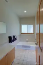 Upstairs Unit Full Bathroom w/ soaking tub.