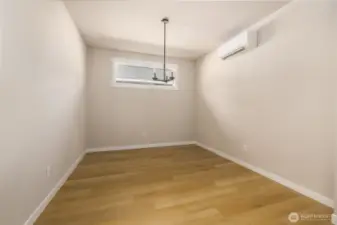 Formal dining room w/lvp flooring adjacent to the kitchen.