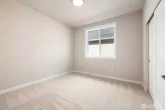 Bedroom #2 The house is built w/9' ceilings, taller windows and painted millwork to keep it light & bright.
