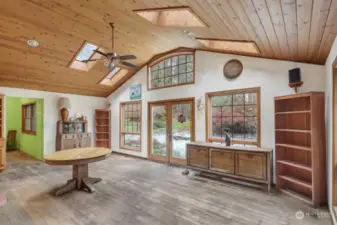 The Dining area off the kitchen can serve many functions. This opens to the patio garden and has abundant light.