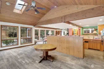 Dining, kitchen areas looking into handy utility room and pantry.