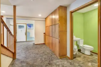 From the great room entrance to the stairs hallway, the back door of the utility room, location of the included washer & dryer.