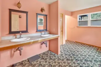 Full bathroom with sinks accessible by wheelchair.