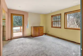 Upstairs bedroom with primer covering former murals.