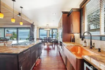 The attention to detail continues throughout the home. The kitchen has a hammered copper farm sink and granite countertops.