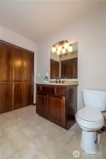 Main bathroom with W/D in the closet