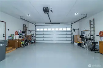2-car garage with epoxy flooring and built-in cabinets