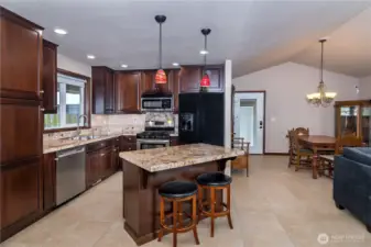 Under-cabinet lighting accentuates the granite countertops