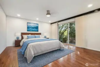 Primary bedroom is large and has slider to large deck. Create your own private oasis with potted plants.
