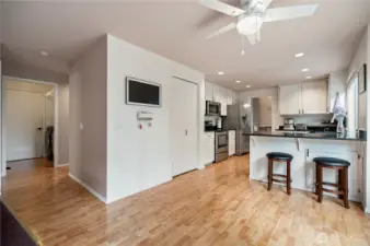 Updated kitchen features granite countertops, stainless steel appliances, and ample cabinet space, all connected to a casual dining nook.